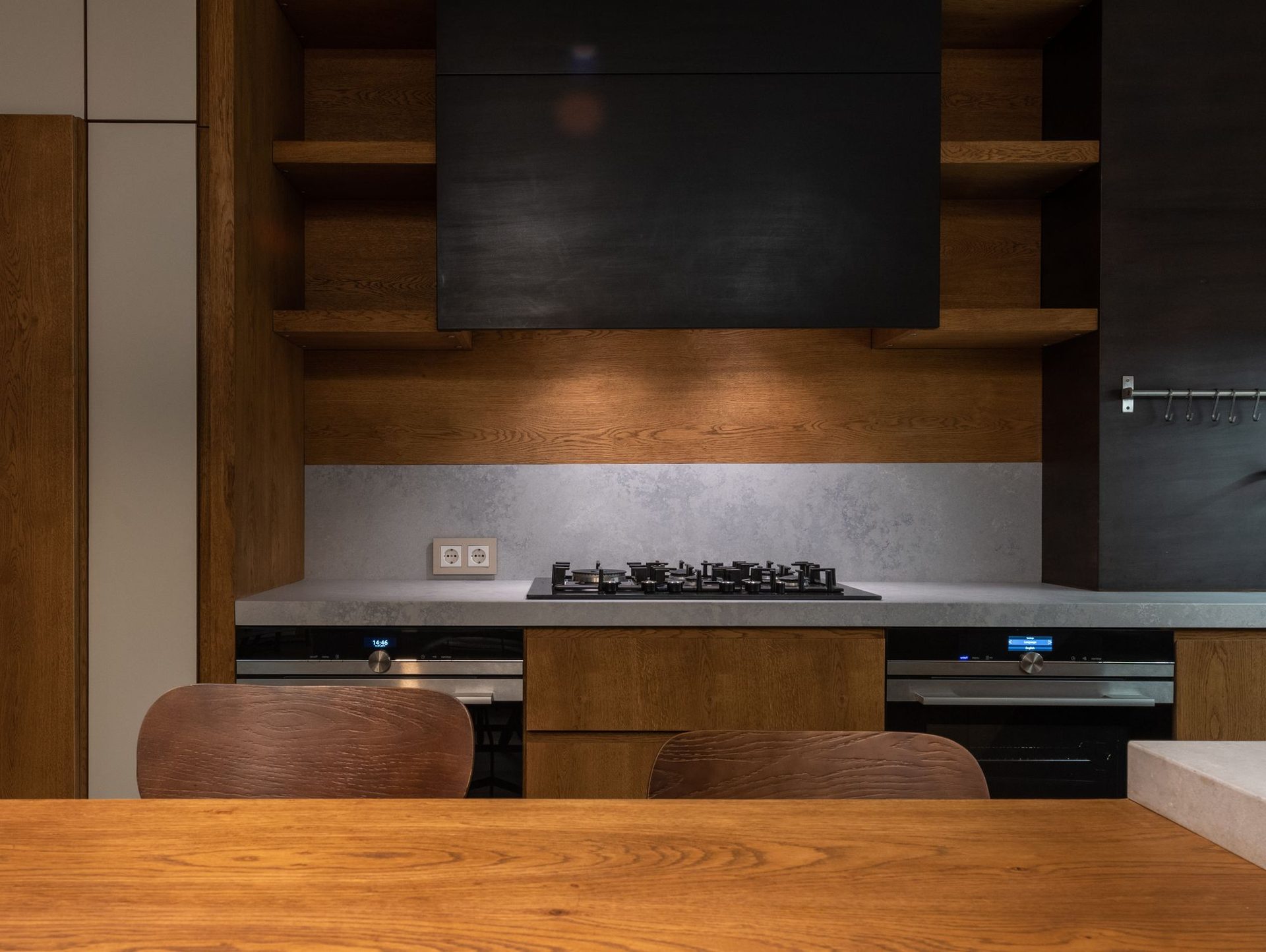 Timber media joinery and stone splashback detail