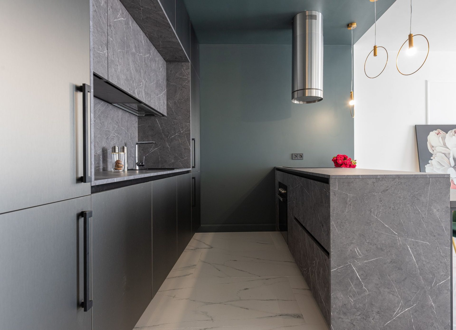 Stone galley kitchen with pendant lighting