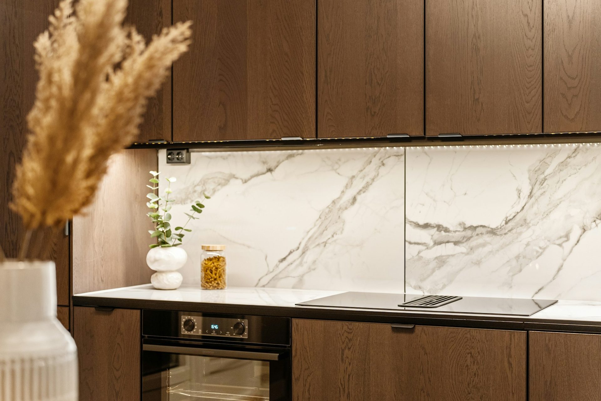 Marble splashback and timber joinery with an integrated oven