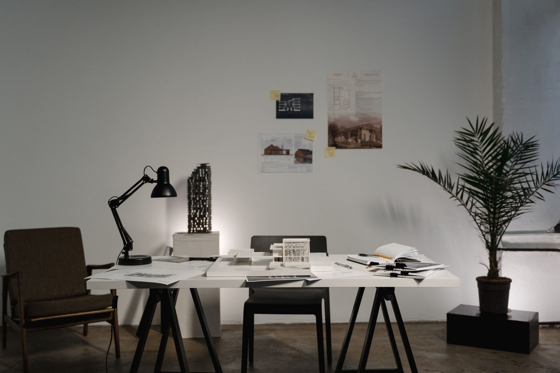 Design studio desk with drawings and material samples