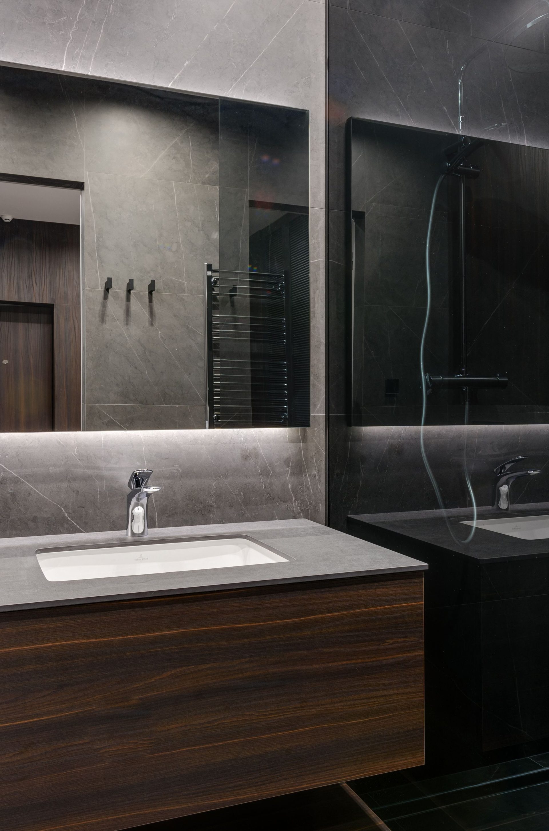 Custom timber bathroom vanity with stone top and backlit mirror