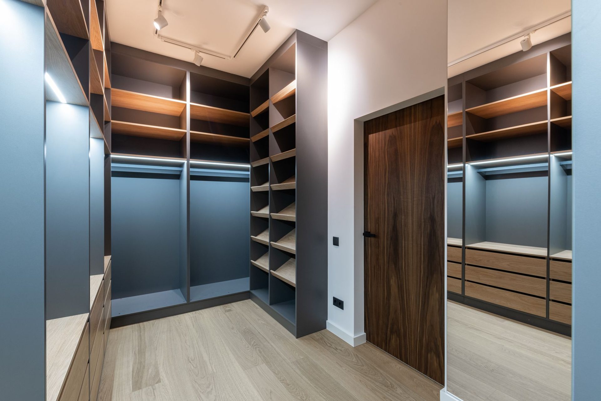 Custom walk-in wardrobe with lit timber shelving and drawers, Rockhampton